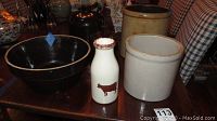 Photo showing the 15-inch crock with lid, 12x6 bowl, milk bottle with cow graphic, and beige crock.