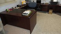 Full assembled view of U-shaped desk showing front and left side modules in office setting