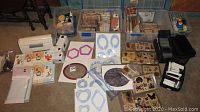 Overview of Cricut machine, cartridges, cutting mats, shape frames, stamps, ink pads and twine