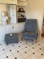 Front view of armchair and ottoman on tiled floor