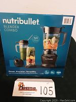 Front of box showing NutriBullet Blender Combo with image of blender, pitcher, and cups.