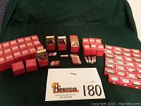 Overall view of all Esterbrook nib boxes and loose nib packs on table.