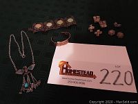 Full lot view showing all jewelry pieces including necklace, bracelet, earrings, and copper floral bracelet