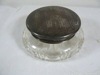 Full view of the compact powder jar with cut glass base and silver lid showing overall condition and design.