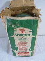 Photo of the original cardboard box of Coleman Model 335 Sportlite lantern with printed branding and usage details. Box shows heavy wear and tears.