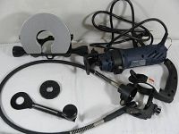 Full view of Mastercraft electric spin saw with blade guard, power cord, and several black metal attachments on white surface.