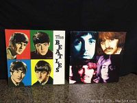 Photo showing both framed canvas prints side by side, displaying front sides with Beatles portraits and vibrant colors.