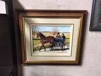 Framed acrylic painting showing a brown horse pulling a buggy with two passengers along a rural road, with fields and tree in background.
