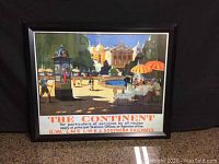 Framed vintage railway poster 'The Continent' with scenic European outdoor scene and detailed railway service information.