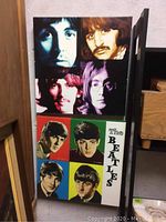 Both framed Beatles prints together showing different portrait styles.