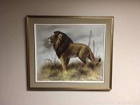 Framed acrylic painting of a lion standing on grassy terrain under a cloudy sky.