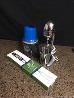 Wolfgang Puck blender, Salton drink mixer, and Chef's fork with thermometer displayed together on a countertop
