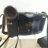 Front-right angled view of the Sharp Hi8 Viewcam video recorder showing lens, brand, and model details.