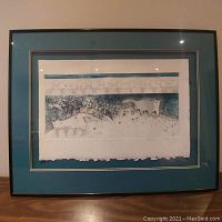 Framed print showing the full artwork and matting in a black frame.