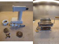 Photo showing KitchenAid sausage grinder attachment with auger, ring nut, and three grinder plates laid out on countertop.