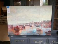 Full view of the 2x3 ft harbor boats canvas art showing multiple boats anchored in calm waters with muted colors and reflections.