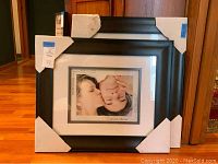 Two new matching black wood picture frames with glass and white & black double matting, each 16 x 20 overall, matted for 11 x 14.