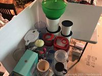 Photo showing an assortment of plastic kitchen storage containers, a Brita pitcher, and mugs.