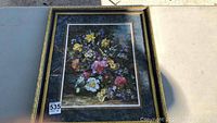 Full view of the large floral print in its gilt composite frame showing the entire image and frame details.