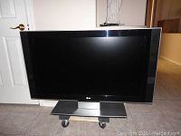 Front view of LG 40 inch flat screen TV on stand.