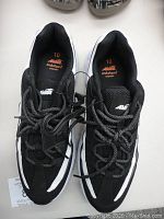 Top down view of black and white Avia Aviva men's tennis shoes size 10, new with tags and Endurapro comfort insole.