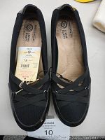 Top view of black women's Earth Spirit shoes with cushion insoles, size 8.5 with tags attached.