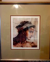 Framed Italian art print with a platinum finish frame, showing a woman in profile. The image has glare reflection on glass but print is clear.