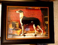 Full view of the framed greyhound print showing the entire dog and background within a dark wood and gold detailed frame.
