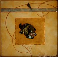 Full view of ceramic clay face sculpture mounted on 24x24 canvas