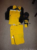 Full lot including FieldGear Sport yellow and black winter jacket, yellow Hilfiger pants, GMC ski gloves, and Hilfiger hat