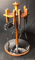 Full view of the complete bar tool set on revolving stand showing all tools hanging and stand design.