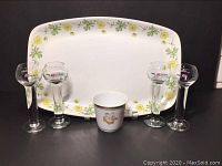 Front view of platter, 4 shot glasses, and Kijafa cup arranged for display