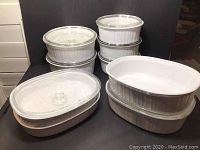 Full set of 16 pieces including white oval and round baking dishes with matching lids.