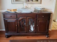 Front view of the buffet showing drawers, doors, finish and overall condition