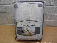 Front view of the new Berkshire VelvetLoft blanket in original packaging showing label and Twin size.