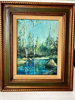 Full view of the framed painting displaying birch trees and a pond reflecting the trees and sky, signed by Mhulshof.
