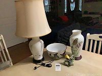 Full view of the lamp, bowl, vase, and American Goldfinch porcelain figurine arranged on a table showing details and scale