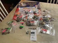 Overview of the coin collection including multiple labeled plastic bags containing coins from various countries and the 50 State Quarter Collector's Map in packaging
