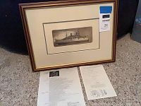 Framed limited edition etching 'Gunboat' with certificate of authenticity and documentation on floor beneath frame.