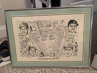 Framed black and white illustration of Yankee Stadium with caricatures of Ruth, Gehrig, Mantle, and DiMaggio and baseball-themed cartoons