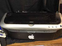 Front view of Epson printer closed, showing Epson branding and design.