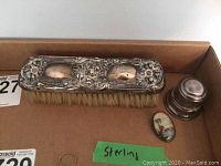 Photo of sterling silver brush, Birks ring box, and oval pin group in lot.