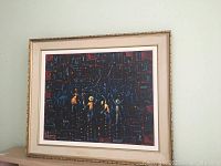 Framed original art showing abstract composition with figures, dark background accented with red and yellow colors.