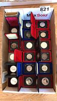 Tray of 17 velvet-cased silver dollar coins