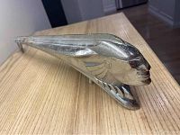 Full-length side perspective showing ornament profile and overall condition