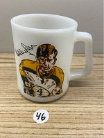 Front view of the white Federal milk glass mug featuring a colored image of Bobby Orr in hockey gear and a signature.