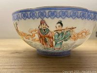 Side view showing hand-painted figures on exterior