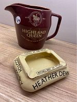 Highland Queen ceramic pitcher and Heather Dew ceramic ashtray side by side on a wooden surface