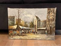 Full image of the canvas painting showing buildings, market stalls and people in an outdoor urban setting.