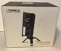 Retail packaging box showing Comica branding, model STM-USB and product image